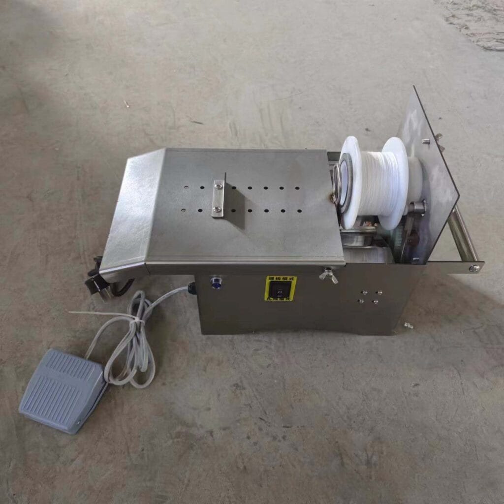 máy buộc xúc xích dùng điện